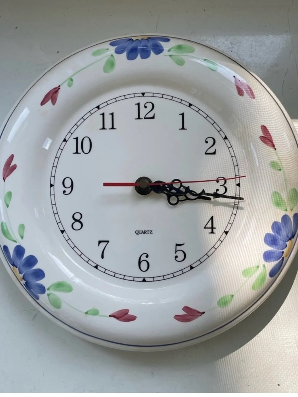 Floral Ceramic Wall Clock in White with Blue and Green Accents